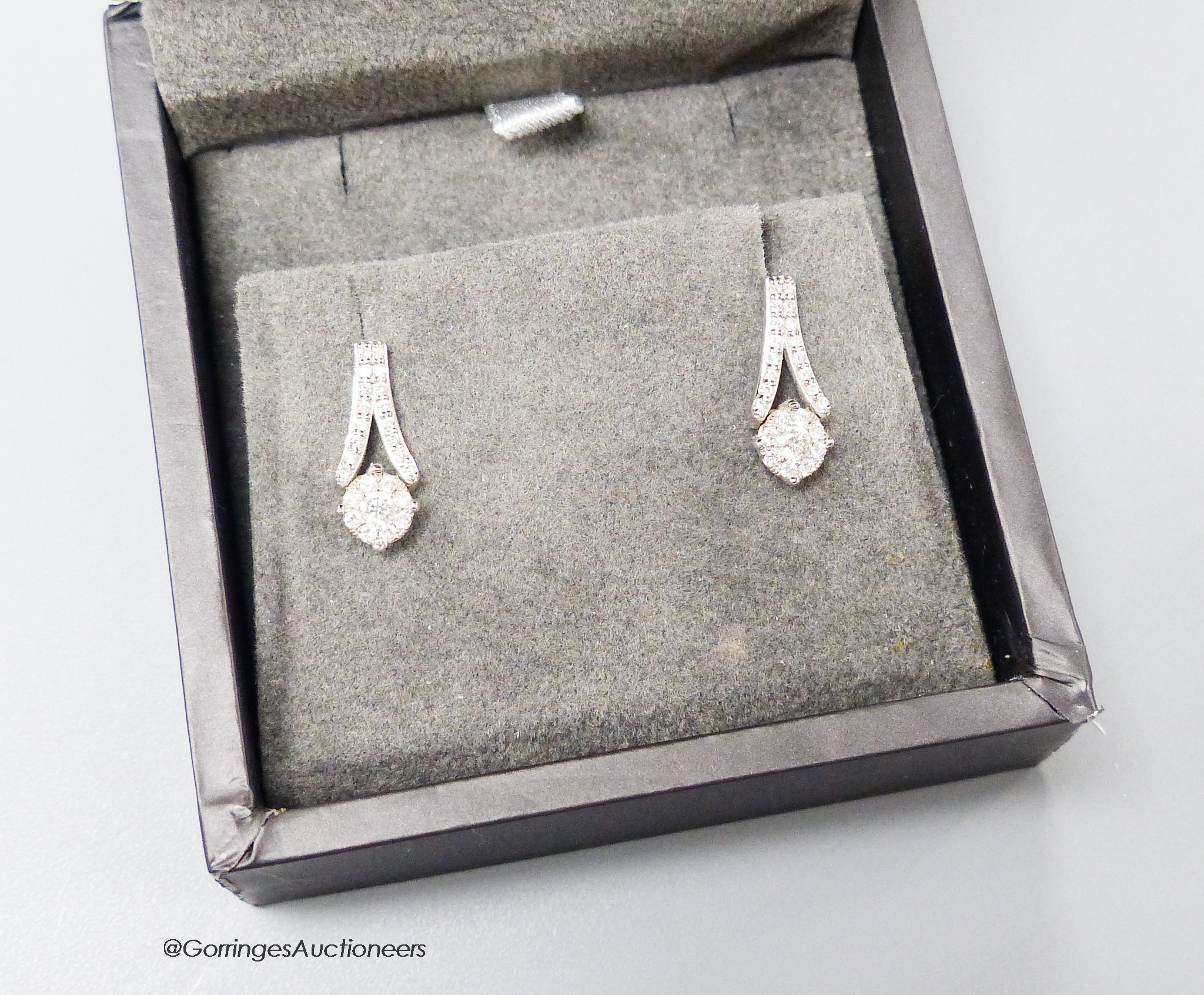 A modern pair of Rox 18ct white gold and shaped diamonds cluster set earrings, 16mm, gross weight 3.1 grams.
